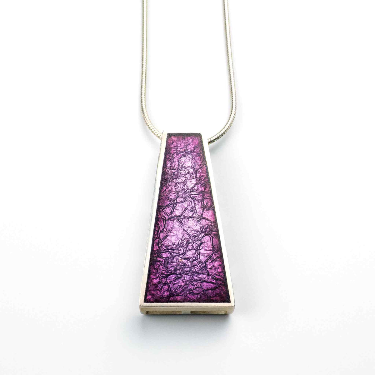 Violet Echo Pendant handcrafted in sterling silver with kiln-fired vitreous enamel in layered shades of purple, featuring a trapezoid shape.