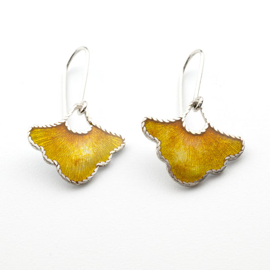 Handmade sterling silver petal earrings with warm yellow vitreous enamel, photographed on a white background