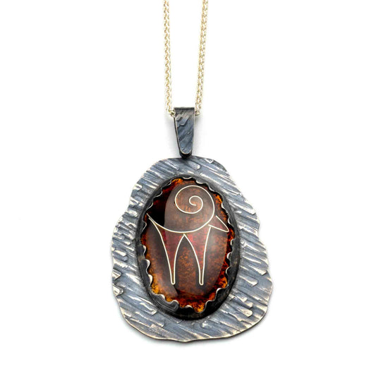 Zagros Spirit Pendant handcrafted in sterling silver with kiln-fired vitreous enamel, featuring an abstract mountain goat inspired by the Zagros Mountains of Persia.