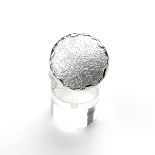 Close-up of Moon of Shiraz Ring showing smooth vitreous enamel surface and handcrafted sterling silver details.