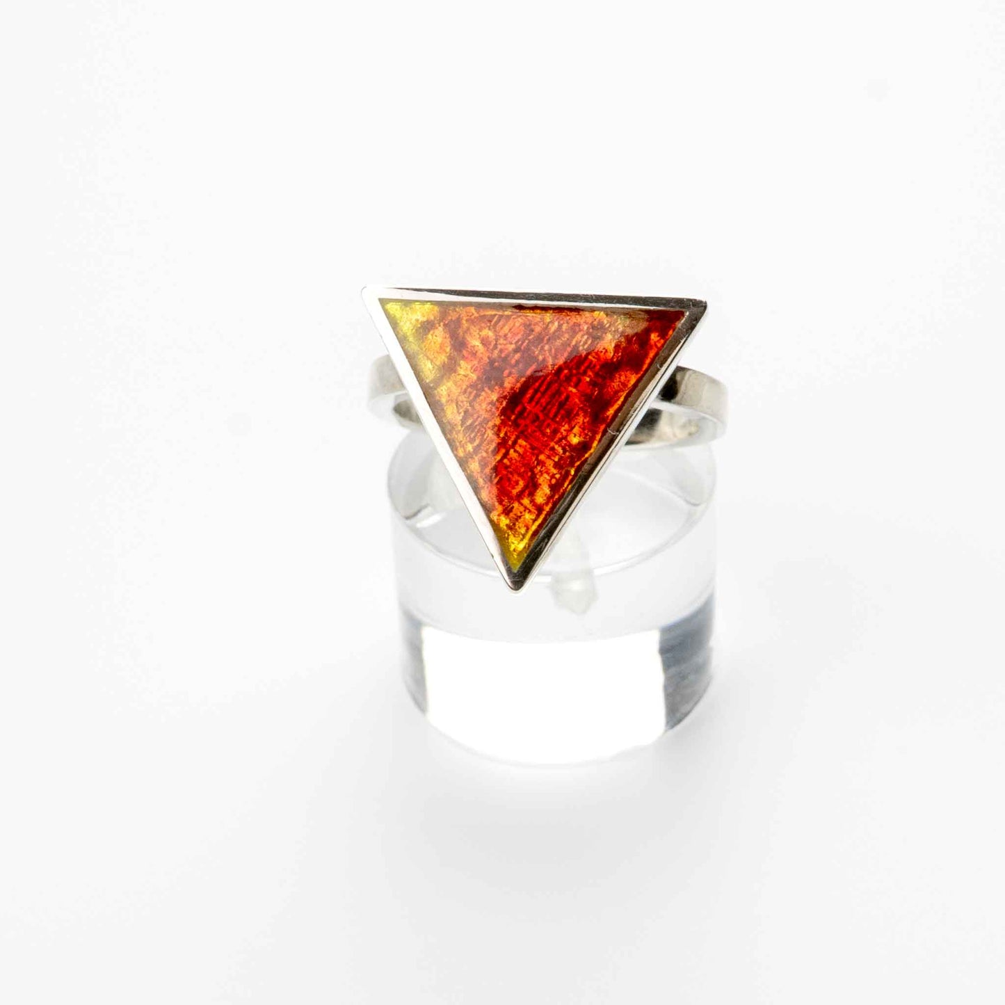 Sunset Ember Ring handcrafted in sterling silver with kiln-fired vitreous enamel in bright yellow and fiery orange, featuring a geometric triangular top.