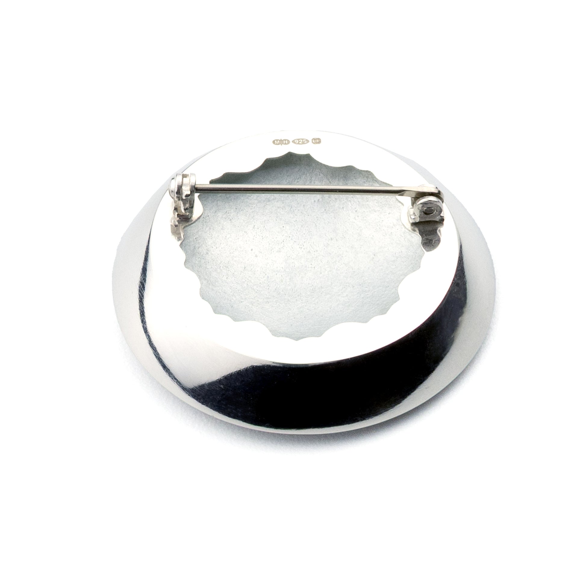 Supernova handmade sterling silver and vitreous enamel brooch -backside displayed on white background