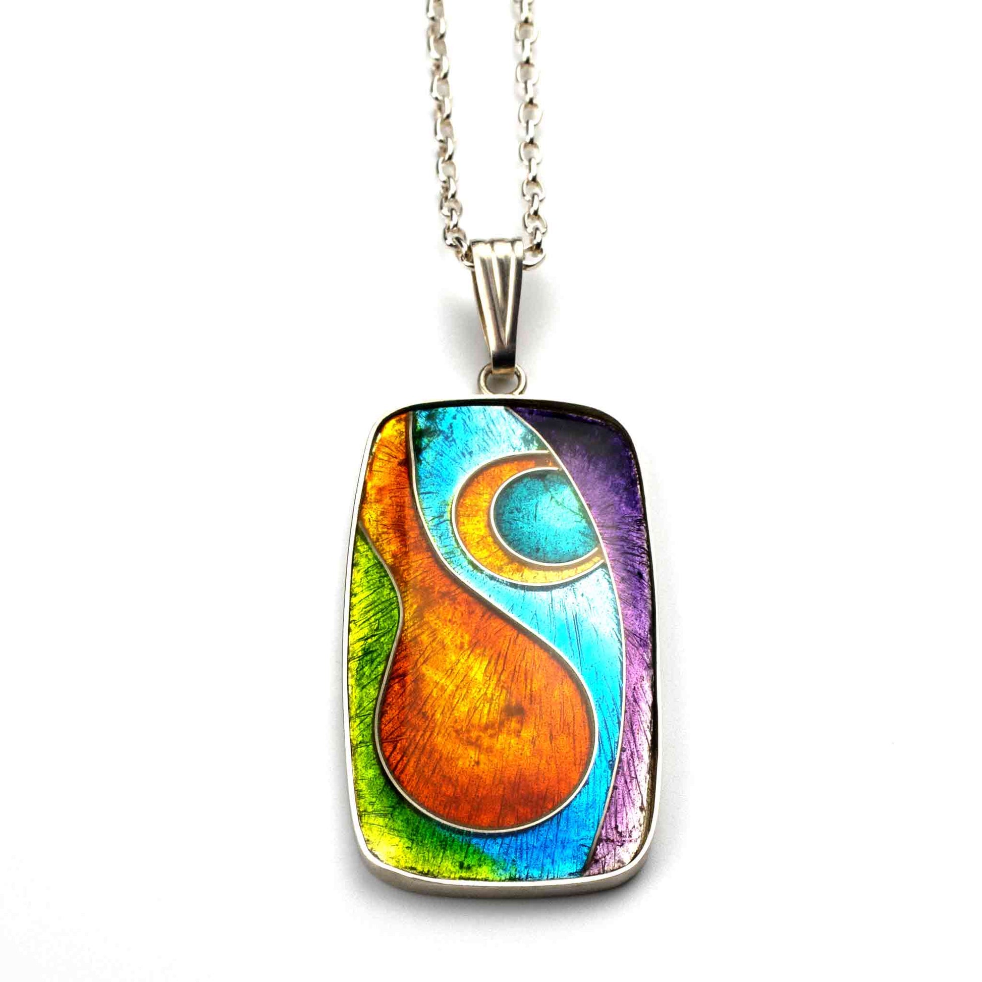 Colorful pendant with a silver chain on a white background