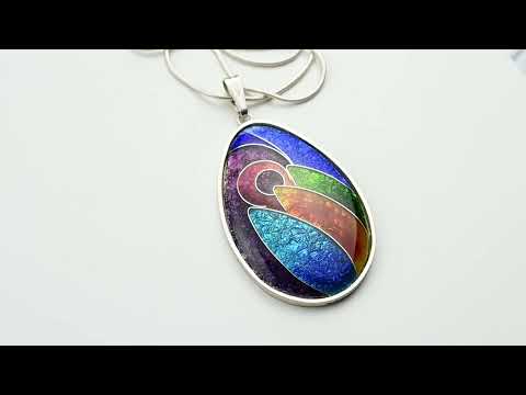 Colorful vitreous enamel pendant with a silver chain on a white background