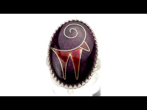 Detail of Zagros Spirit Ring showing kiln-fired vitreous enamel in purple and deep red on sterling silver.